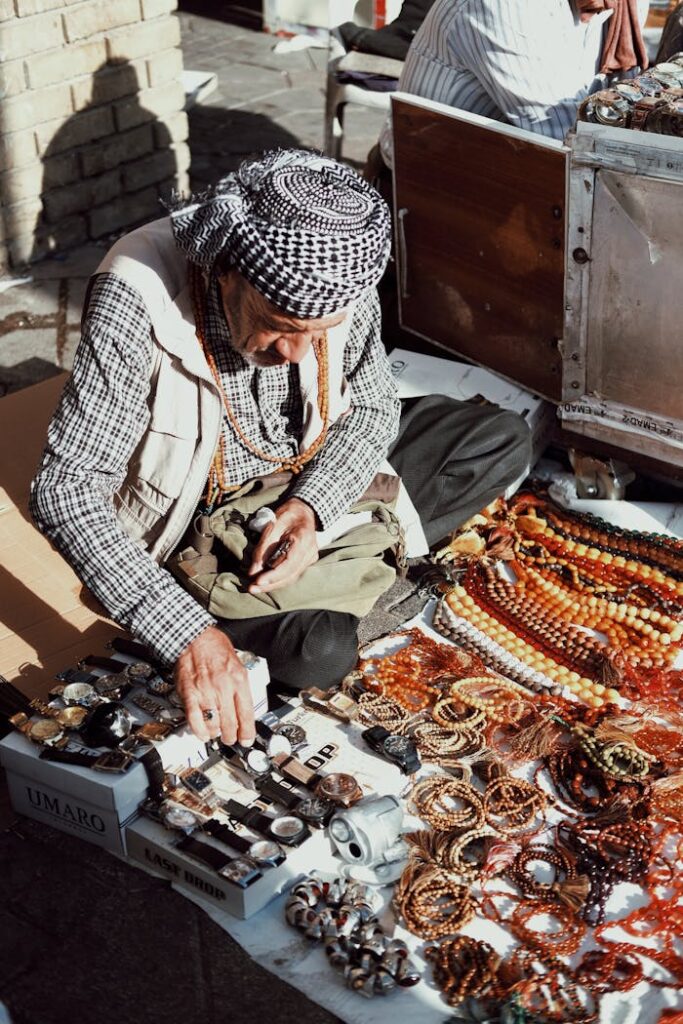 Elderly Man Selling Accessories on the Street